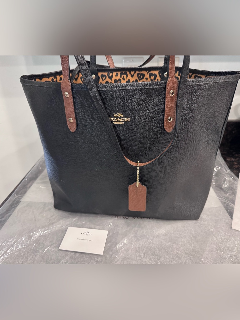 Coach Black Leather Tote with Brown Handles and Leopard Lining